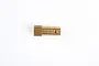 A brass pinion gear for RC cars, shown from a side profile against a white background.
