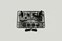 A black plastic sprue containing various gear box case parts for a Tamiya RC model, shown against a plain light grey background.