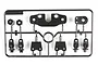 A black plastic parts tree for Tamiya RC cars containing wheel hexes, servo saver parts, and chassis mounts.