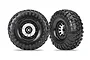 Two Traxxas 2.2 inch Method black chrome rims with Canyon Trail tyres, shown from front and angled views against a white background.