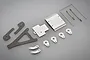 A collection of Tamiya Hotshot pressed metal parts and components laid out on a grey background.