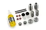 Tamiya silver aluminium shock absorber kit components including two shock bodies, springs, shafts, O-rings, pistons, and a bottle of Tamiya damper oil.