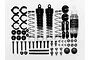 Tamiya C.V.A short shock absorber kit including two shock bodies, springs, spacers, mounting hardware, and a bottle of Tamiya damper oil.