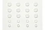 A set of white plastic shock piston discs and spacers arranged in rows on a white background.