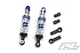 Two Pro-Line Pro-Spec aluminium threaded shock absorbers with blue and silver components, plus additional black plastic rod ends and ball studs.
