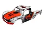 Traxxas Unlimited Desert Racer body shell with a white and grey camouflage pattern, bright orange hood, and Fox Racing branding.