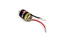 A Dynamite 380 size brushed RC motor with black and red wires attached, featuring a black casing with the Dynamite logo and a yellow caution label.