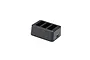 A black Ryze Tello battery charging hub with three slots for drone batteries, shown from a high angle on a white background.