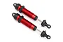 Two red anodized aluminium GTR threaded shock absorbers for Traxxas UDR, featuring black plastic caps and rod ends, isolated on a white background.