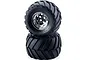 Two Tamiya Wild Willy 2 monster truck wheels stacked vertically against a white background.