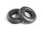 Two black rubber RC buggy front tyres with ribbed tread patterns on a white background.