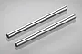 Two identical silver-coloured metal shafts laid parallel on a light grey reflective surface.