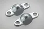 Two Tamiya Hornet metal shock mount brackets shown on a light grey background.