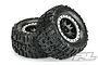 Two Pro-Line Trencher RC monster truck tires mounted on black Impulse Pro-Loc wheels with stone grey beadlock rings, isolated on a white background.