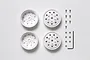 Four matte white Tamiya 1/14 scale RC truck rear rims with included assembly screws, nuts, and an Allen key on a white background.
