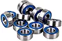 A collection of small metal ball bearings with blue rubber seals, arranged in a pile against a white background.
