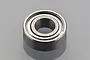 A single metal shielded ceramic ball bearing for RC vehicles against a grey background.