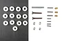 A collection of Tamiya RC spare parts including plastic washers, metal screws, nuts, pins, and bushings arranged on a split black and white background.