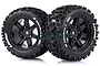 Two Louise X-Uphill RC monster truck tyres pre-glued onto black spoke rims, shown against a white background.
