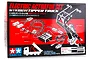 Tamiya 1/14 scale electric actuator set packaging box showing the included motor, control unit, wiring, and mechanical assembly components.