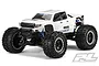 Pro-Line Brute Bash Armor white body shell mounted on a Traxxas X-Maxx RC truck chassis with large black off-road tires.