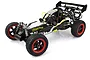 Rovan Baja 29cc 1/5 scale 4WD petrol RC buggy with black and white body, red wheel rims, and rear wing on a white background.