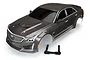 A pre-painted silver Traxxas Cadillac CTS-V RC car body shell with black windows and a separate black plastic mounting bracket on a white background.