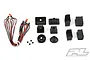 Pro-Line Universal LED Headlight and Tail Light kit components including LED wires, plastic light buckets, and mounting screws on a white background.
