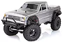 A silver 1/10 scale HSP Boxer RC rock crawler truck with black fender flares and off-road tires, shown from a front three-quarter angle on a white background.