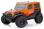 HSP Ryder 1/10 scale RC truck with an orange and black body, featuring off-road tires and a front bumper with spotlights.