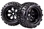 Two black RC monster truck wheels with aggressive off-road tread patterns and multi-spoke rims against a white background.