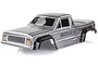 A silver painted RC crawler body shell for the HSP Boxer, featuring black wheel arches and detailed decals on a white background.