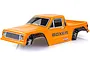 A pre-painted orange HSP Boxer RC crawler body shell with black fender flares, white grille, and blacked-out windows on a white background.