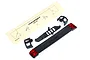Traxxas TRX-4 Sport tailgate assembly parts including a black tailgate panel with red light lenses, mounting brackets, and a decal sheet on a white background.