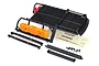 Traxxas TRX-4 expedition rack with orange recovery boards, red fire extinguisher, mounting rails, hardware, and decal sheet on a white background.
