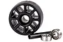 A black plastic wheelie bar wheel for an RC car, accompanied by a metal axle sleeve and two ball bearings on a white background.