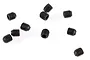 A collection of nine small black metal grub screws scattered on a white background.