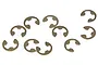 A collection of ten small metal E-clips scattered on a white background.
