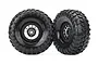 Two Traxxas 1.9 inch Method wheels with Canyon Trail tires, featuring black rims and aggressive tread patterns, isolated on a white background.