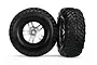 Two Traxxas 2.2/3.0 inch off-road RC wheels with black rubber tyres and silver and black split-spoke rims against a white background.