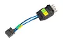 Traxxas TRX-4 LED 4-in-1 wire harness with a black connector block, blue and black wires, and a small module featuring green and yellow indicator squares.