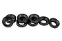 A set of eight small black plastic pivot ball caps for RC car suspension, arranged in a group against a white background.