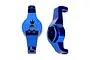 Two blue anodized aluminium portal drive caster blocks for Traxxas TRX-4 RC cars, shown from front and side angles.