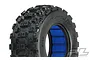 A single Pro-Line Badlands MX short course RC tyre with aggressive tread and a blue foam insert, isolated on a white background.