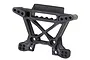 A black plastic front shock tower for a Traxxas Rustler 4x4 RC car, shown against a plain white background.