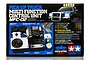 Product packaging for Tamiya MFC-02 Multi-Function Control Unit, showing the control unit, speaker, vibration unit, and LED lights on a blue background.