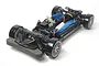 A Tamiya TT-02D RC drift car chassis kit shown from a high-angle front three-quarter view against a white background.