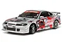 Tamiya Nismo Coppermix Silvia RC drift car model in silver with red and black racing decals on a white background.