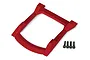 A red Traxxas Rustler 4x4 body roof skid plate shown from a top-down angle with four included black mounting screws.
