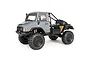 A studio shot of the grey Axial SCX10 II UMG10 RC rock crawler truck featuring a driver figure, roll cage, and large off-road tires.